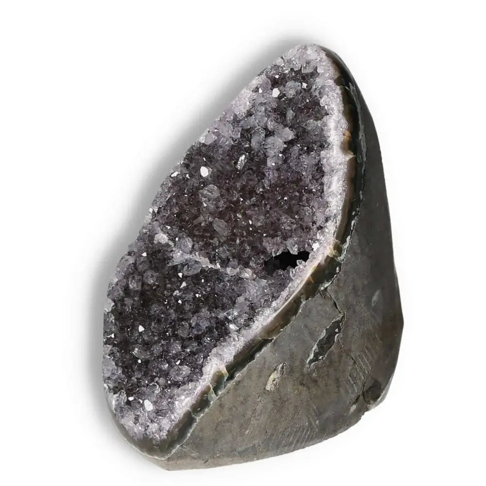 Amethyst cut base geode from Sylvia Crystals, a decorative piece known for reducing stress and enhancing emotional stability.