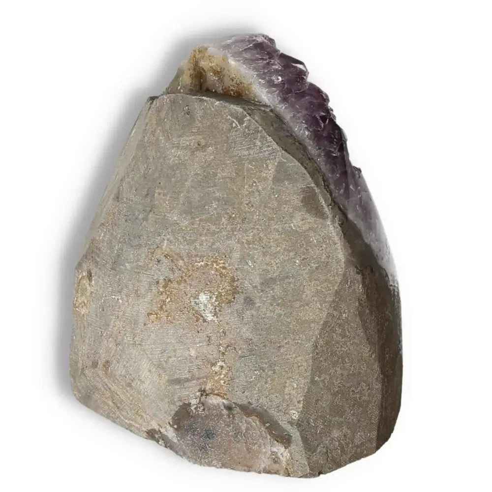 Amethyst cut base geode by Sylvia Crystals on white background, designed for emotional balance and stress reduction.