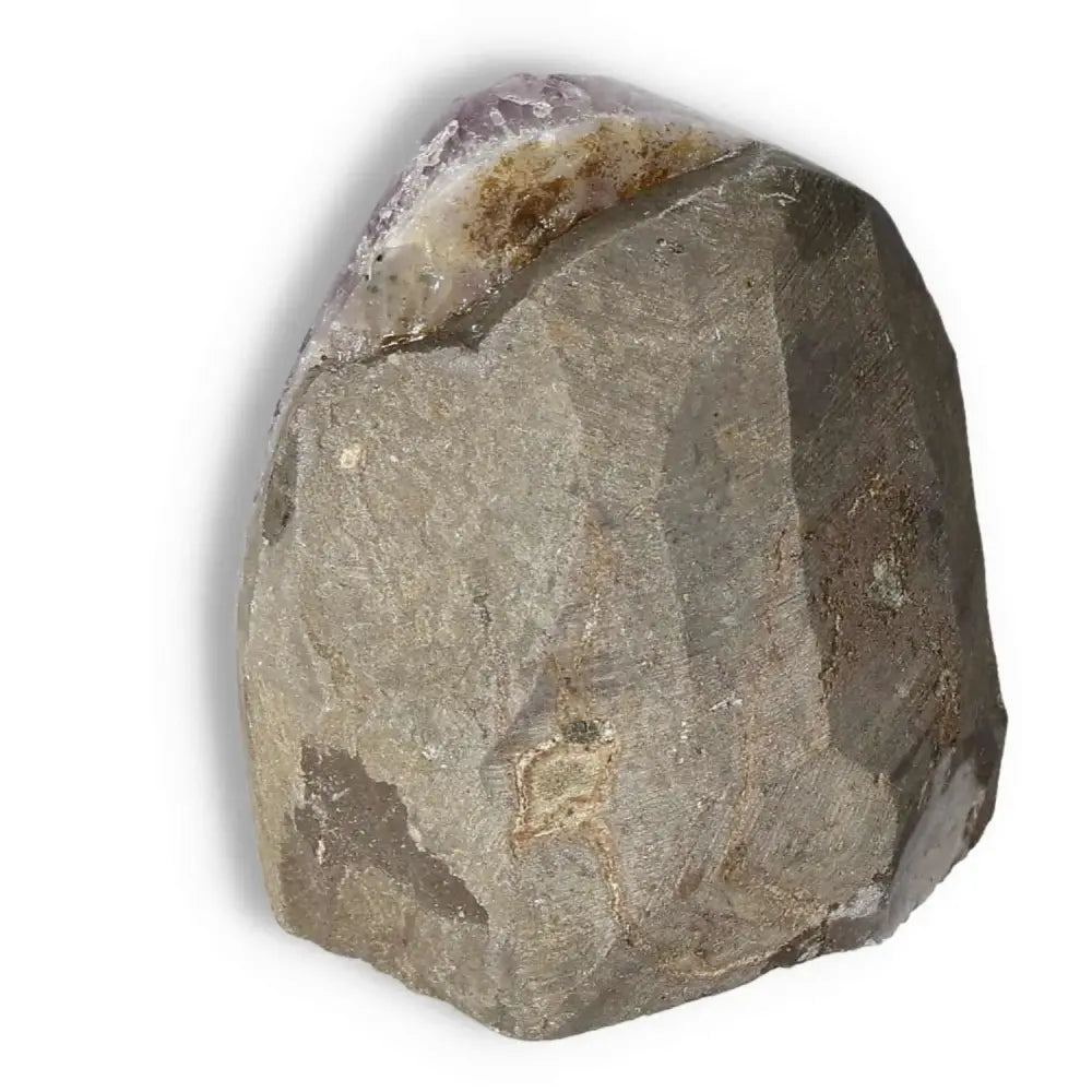Amethyst cut base geode by Sylvia Crystals, known for enhancing concentration and reducing stress, with rustic natural exterior.