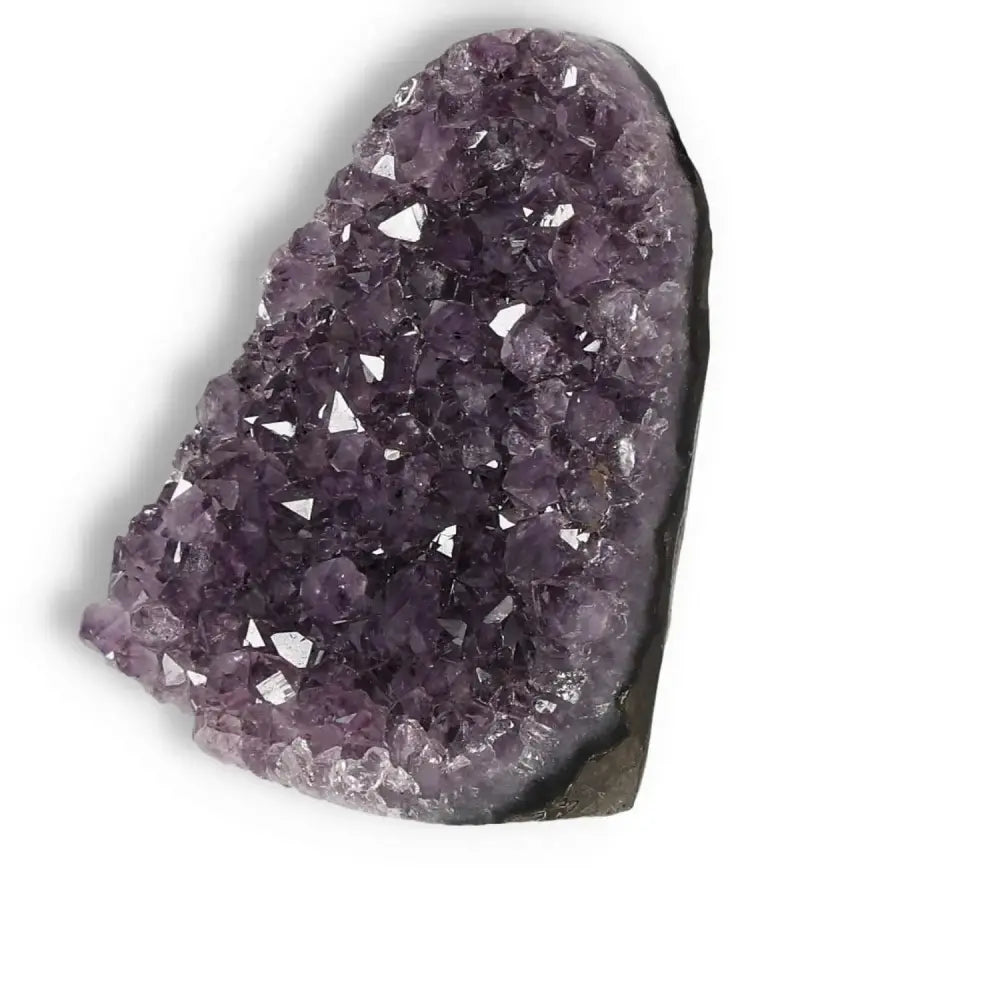 Amethyst cut base geode with deep purple crystal formations from Sylvia Crystals, symbolizing tranquility and positive energy.