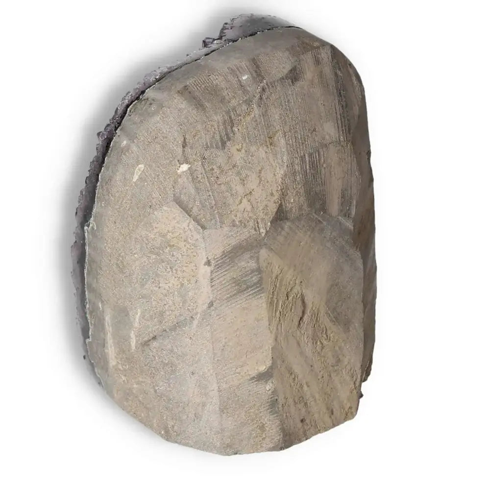 Amethyst cut base geode from Sylvia Crystals, showcasing its natural raw form, perfect for decoration and spiritual rejuvenation.