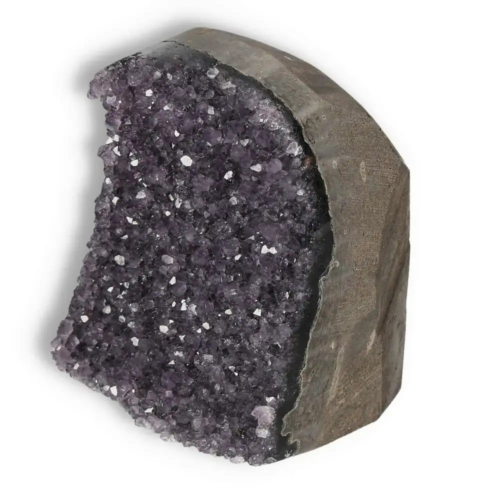 Amethyst cut base geode from Sylvia Crystals, enhancing decor and spiritual energy, known for reducing stress and boosting concentration.