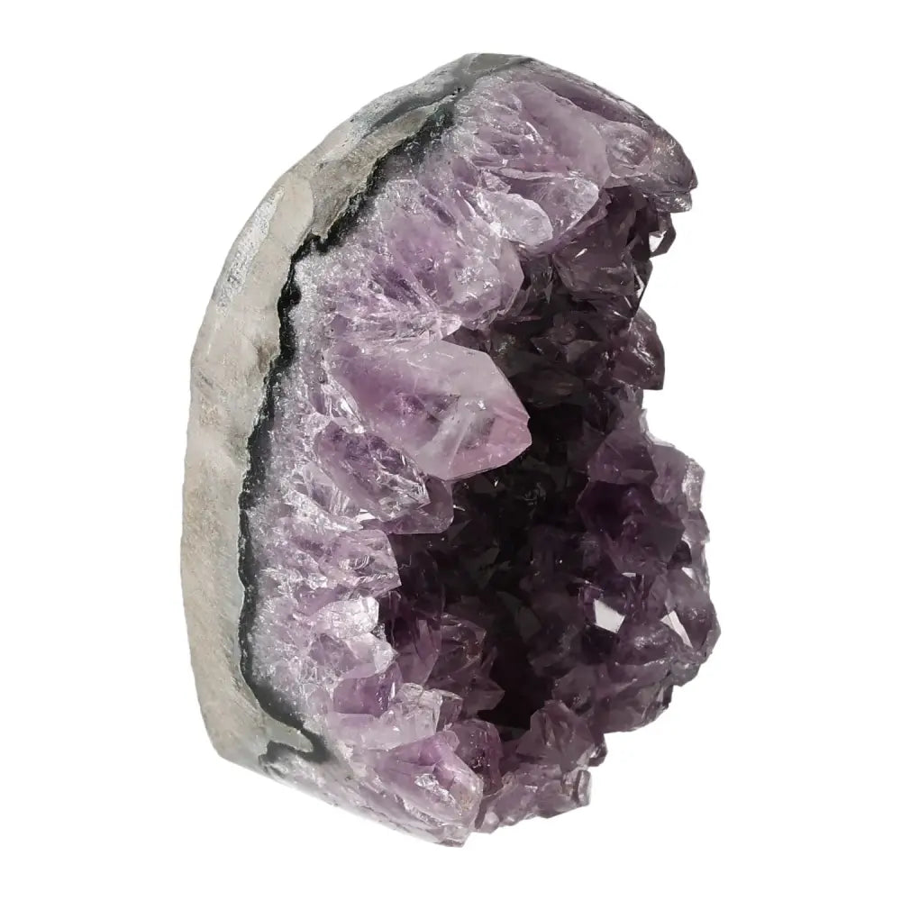 Amethyst cut base geode showcasing natural purple crystals and elegant design from Sylvia Crystals.