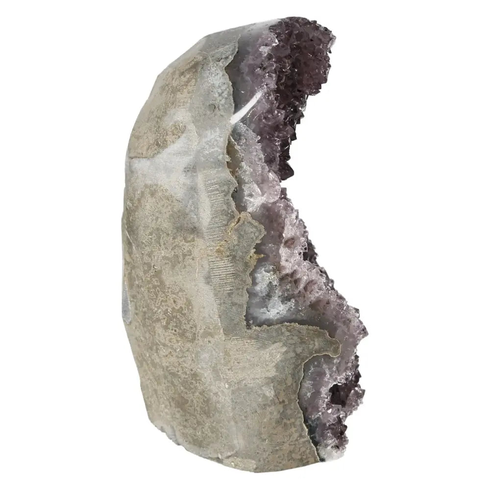 Amethyst cut base geode from Sylvia Crystals, elegantly displayed, showcasing its raw edges and glittering crystals for stress relief.