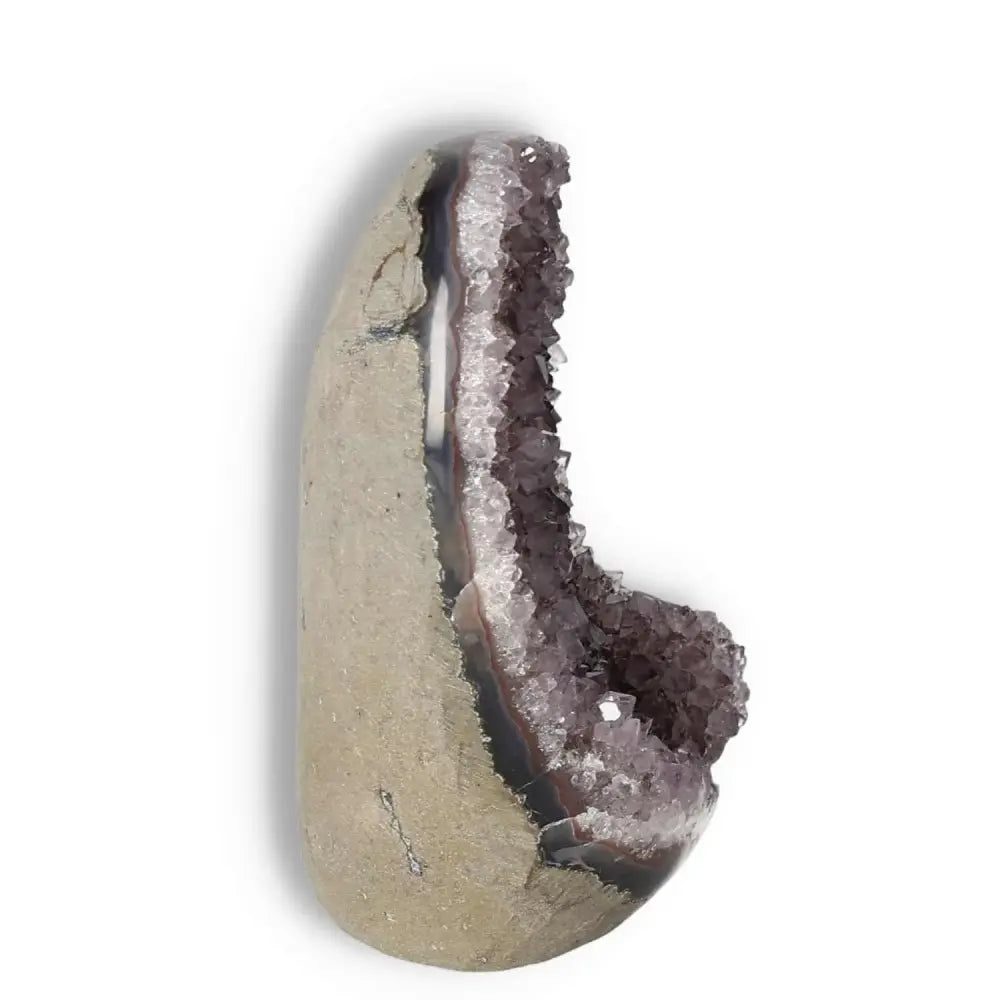 Amethyst cut base geode by Sylvia Crystals, featuring elegant purple crystal formations ideal for luxury home decor and stress relief.