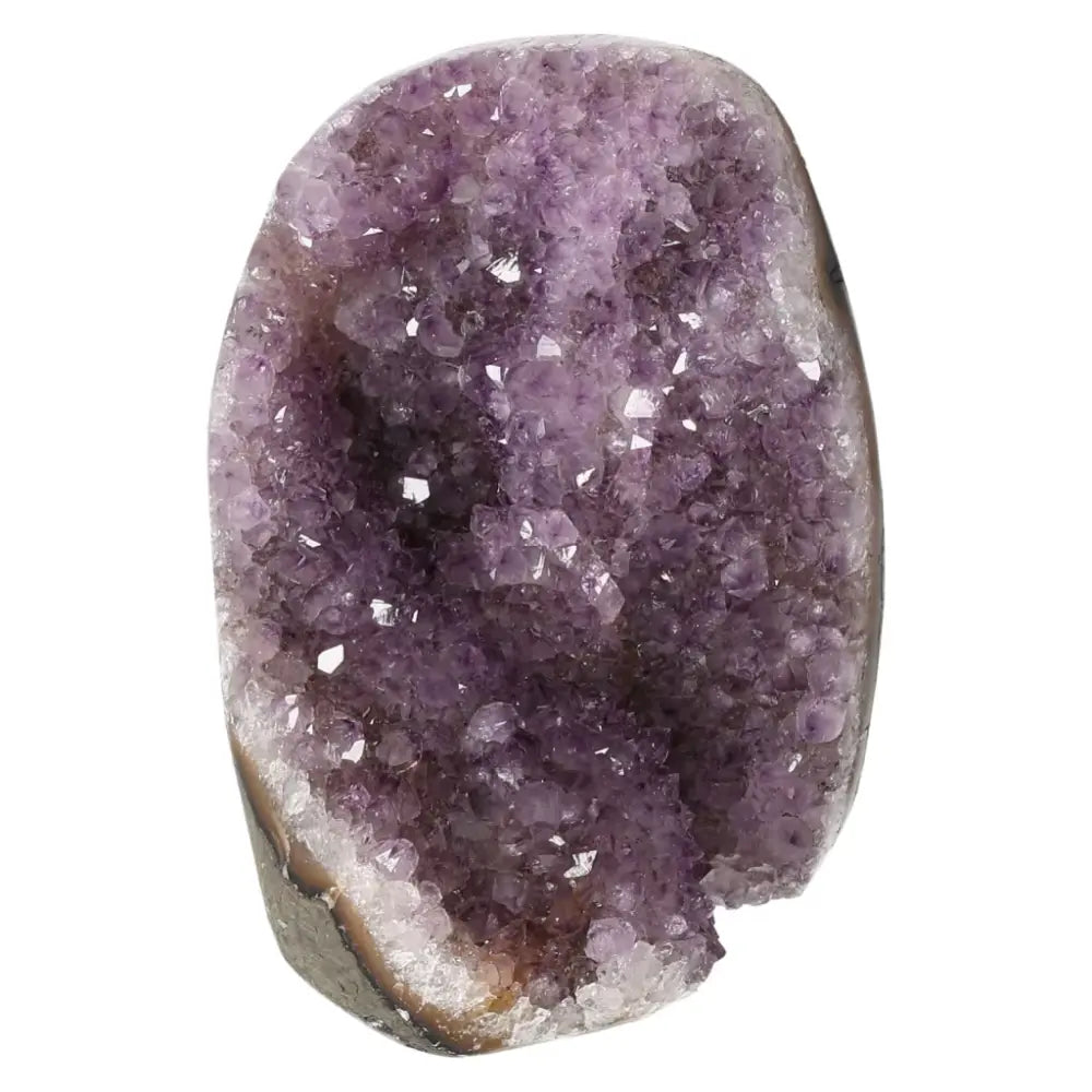 Amethyst cut base geode showcasing vibrant purple crystals, offering natural beauty and spiritual depth for transformative energy.