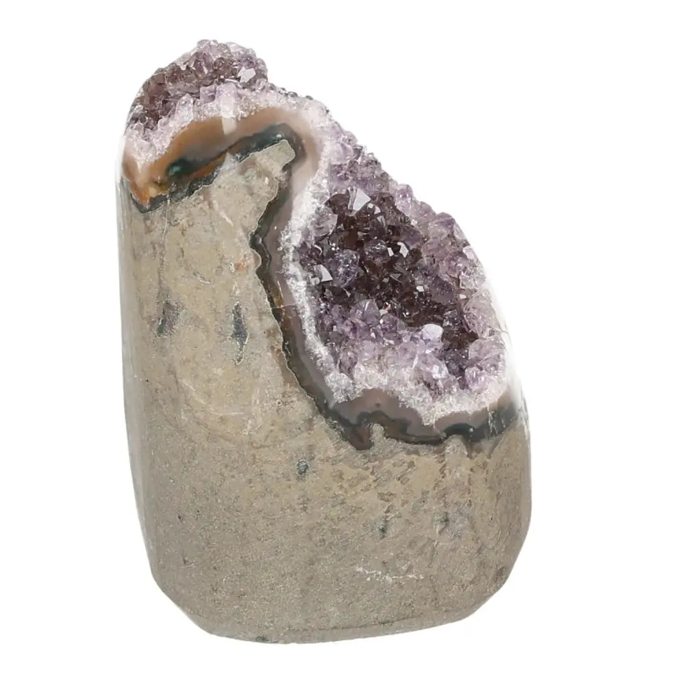 Amethyst cut base geode from Sylvia Crystals showcasing natural beauty and spiritual harmony, perfect as a calming centerpiece.