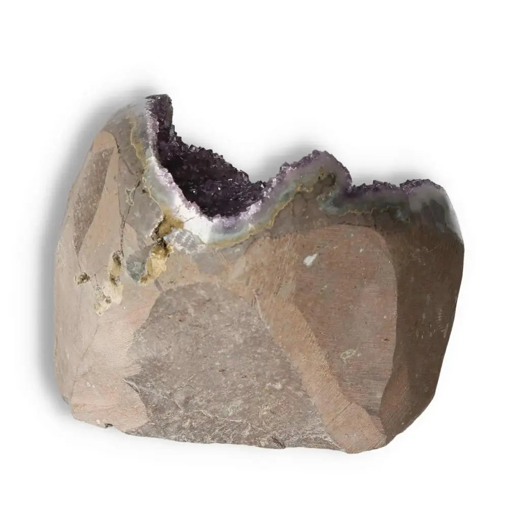 Amethyst cut base geode from Sylvia Crystals with rich purple hues and crystalline structure, known for stress reduction and spirit invigoration.
