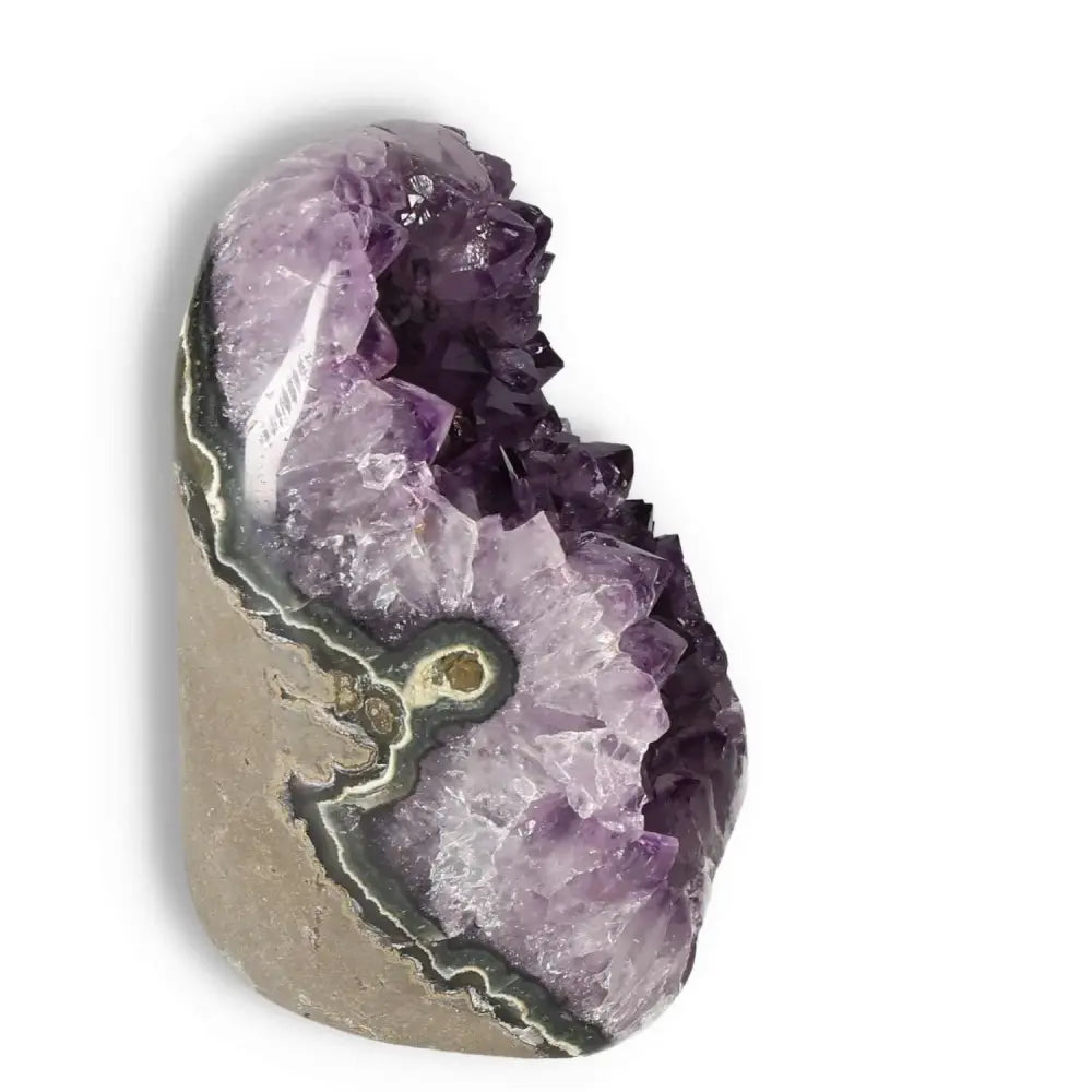 Amethyst cut base geode by Sylvia Crystals, a handpicked gem known for stress relief and spiritual elegance.