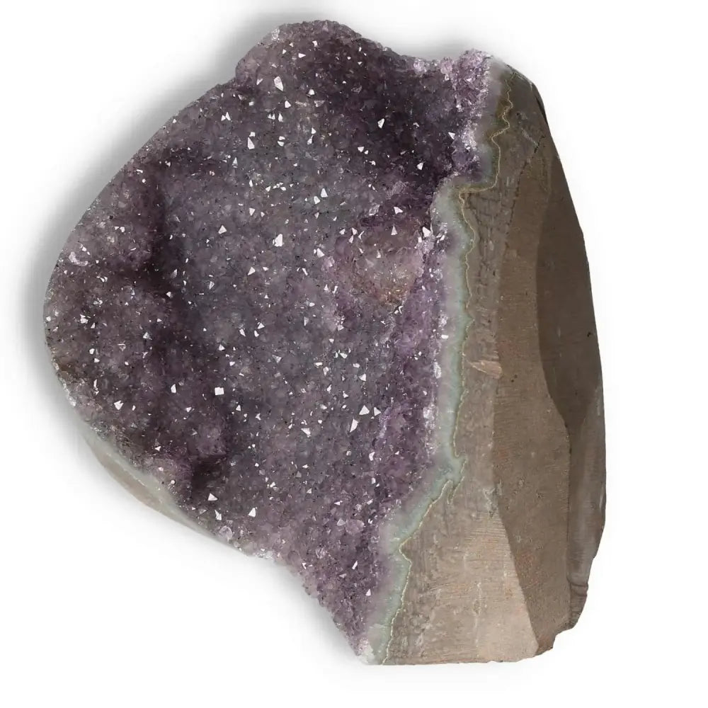 Stunning Amethyst cut base geode with deep purple hues and sparkling crystalline structure from Sylvia Crystals.