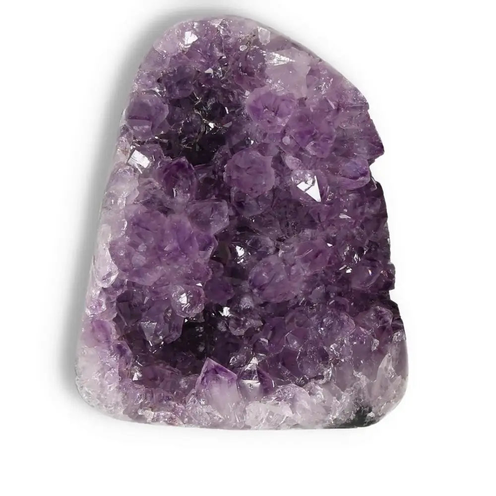 Amethyst cut base geode by Sylvia Crystals, known for stress relief and spiritual enhancement. Exquisite purple gemstone display.