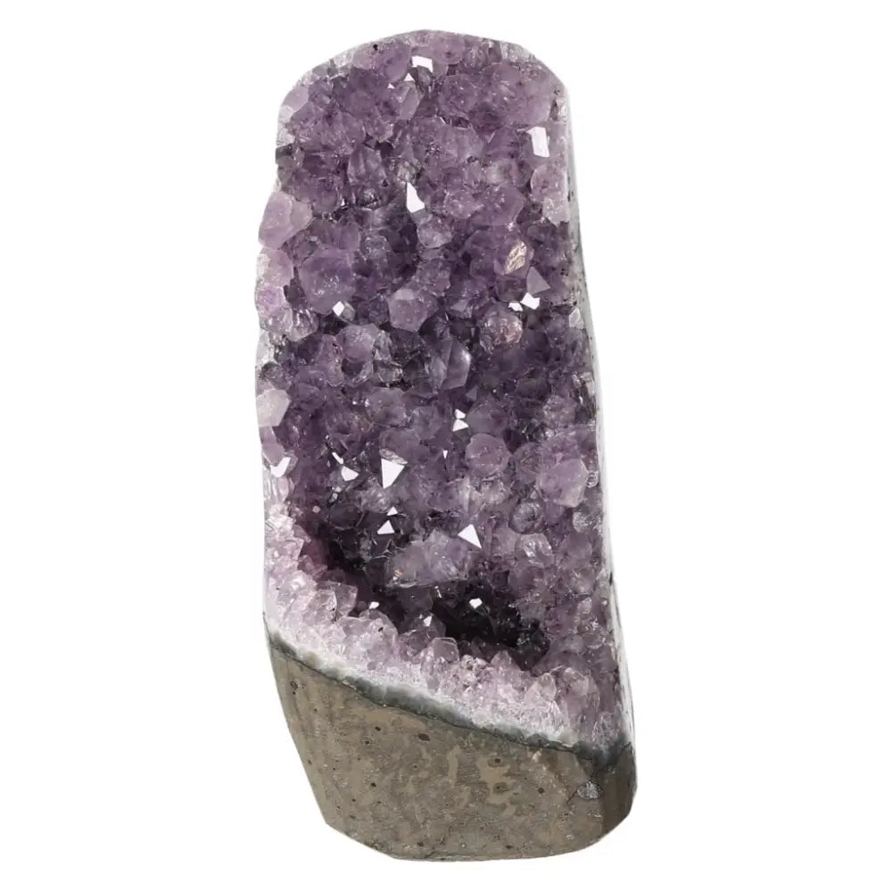 Amethyst cut base geode from Sylvia Crystals, showcasing exquisite purple crystals with stress-reducing and energy-boosting benefits.