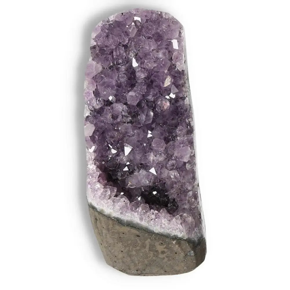 Amethyst cut base geode from Sylvia Crystals, known for quality and beauty, offers stress-reducing and energy-boosting benefits.