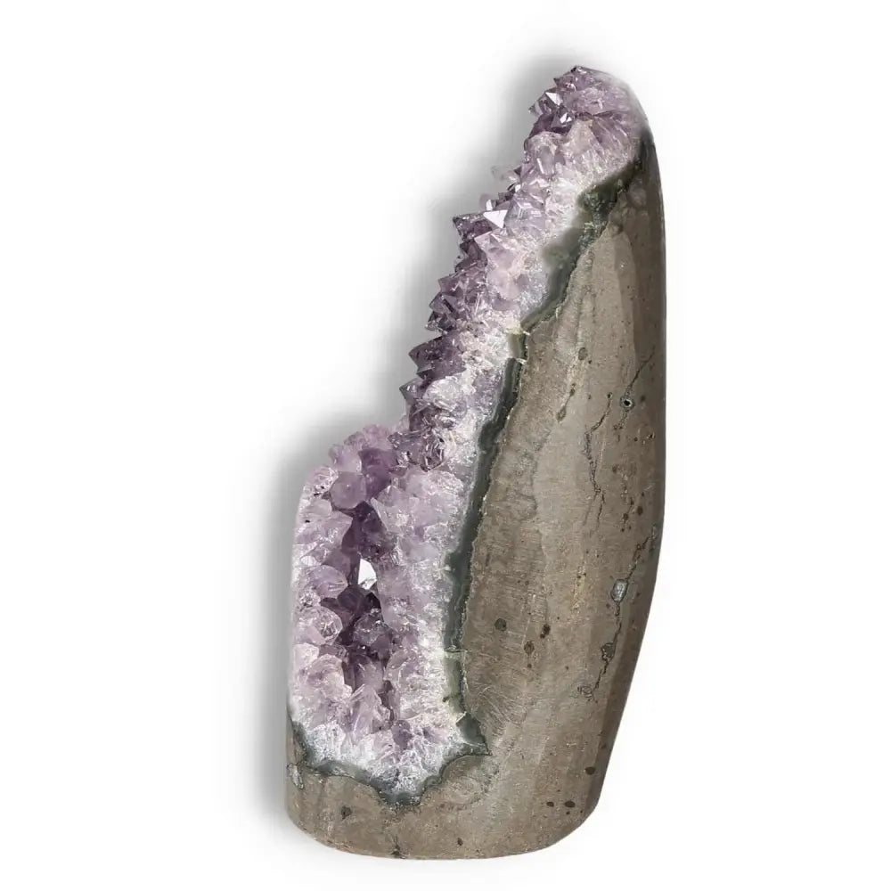 Amethyst cut base geode from Sylvia Crystals, renowned for stress reduction and energy boost, showcasing quality and beauty.