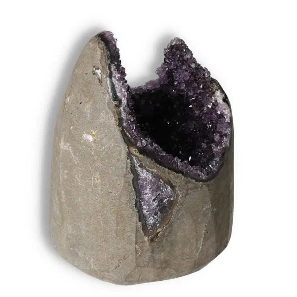 Amethyst cut base geode from Sylvia Crystals, showcasing its shimmering purple crystals, perfect for stress relief and emotional stability.