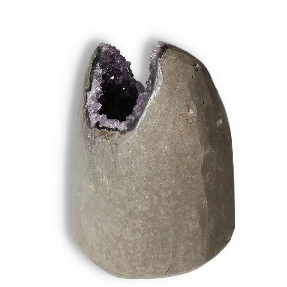 Amethyst cut base geode by Sylvia Crystals, enhances tranquility, stress reduction, and concentration. Ideal for home decor or meditation.