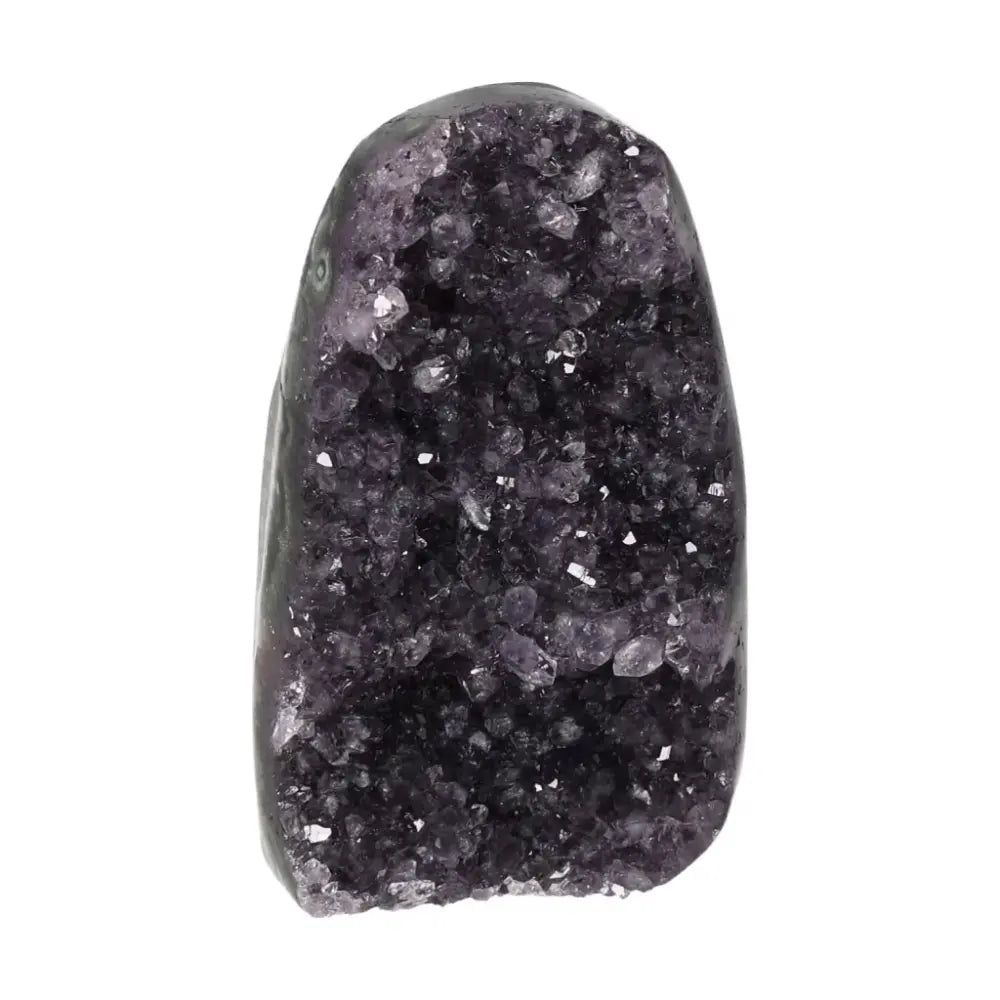 Amethyst geode from Sylvia Crystals, showcasing deep purple hues and sparkling crystal formations for stress reduction and mindfulness.