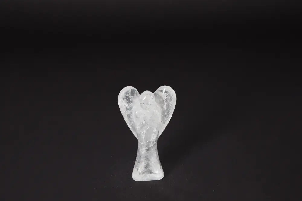 Angel Lemurian Quartz 10 cm crystal figurine on black background, known for stress reduction, energy boost, and emotional stability.