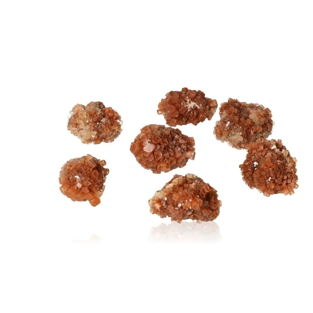 Cluster of aragonite druzy stones in warm amber tones, known for grounding and balancing energy, ideal for collectors and tranquil spaces.