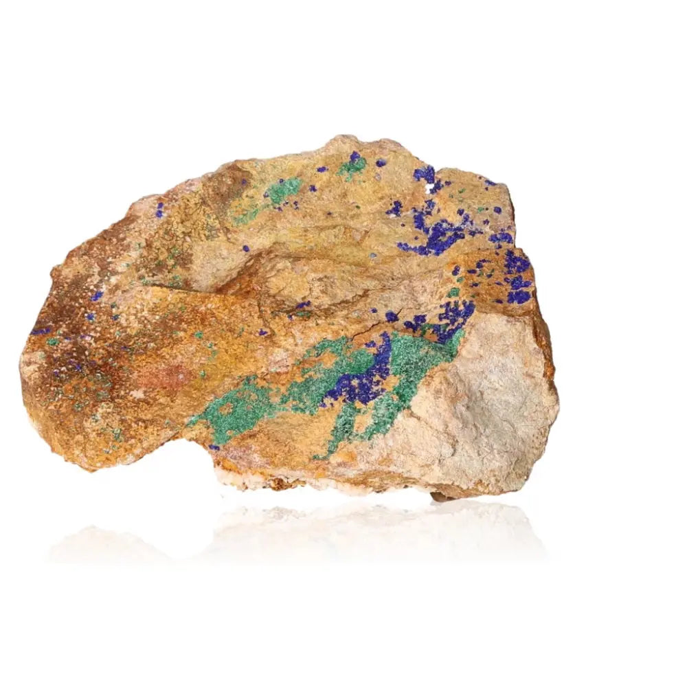 Azurite with Malachite mineral showcasing deep blue and green hues on a rock surface, symbolizing harmony and transformation.