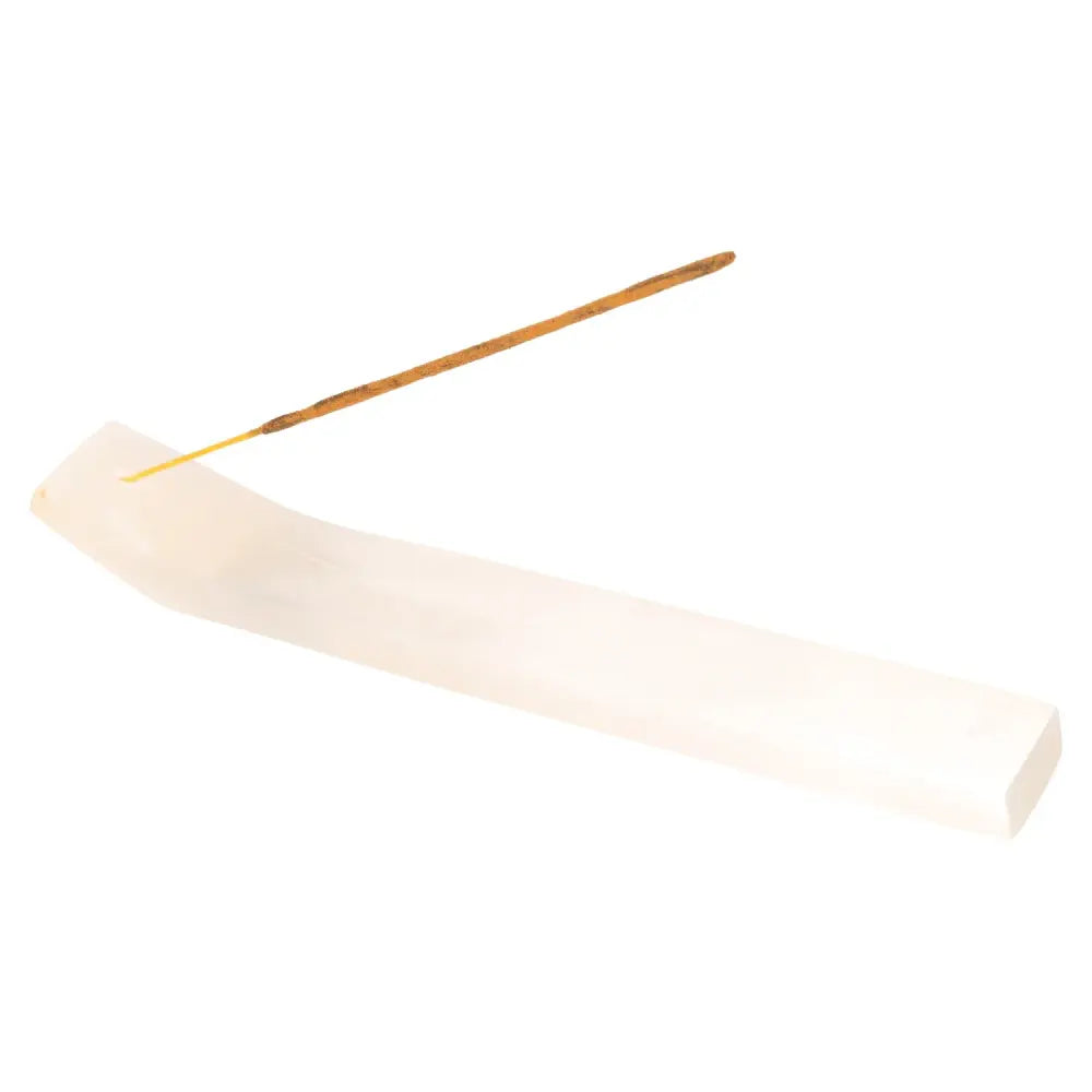 Incense stick burning on a sleek white holder, ideal for Bali Harmony Incense Blend, promoting balance and serenity in your space.