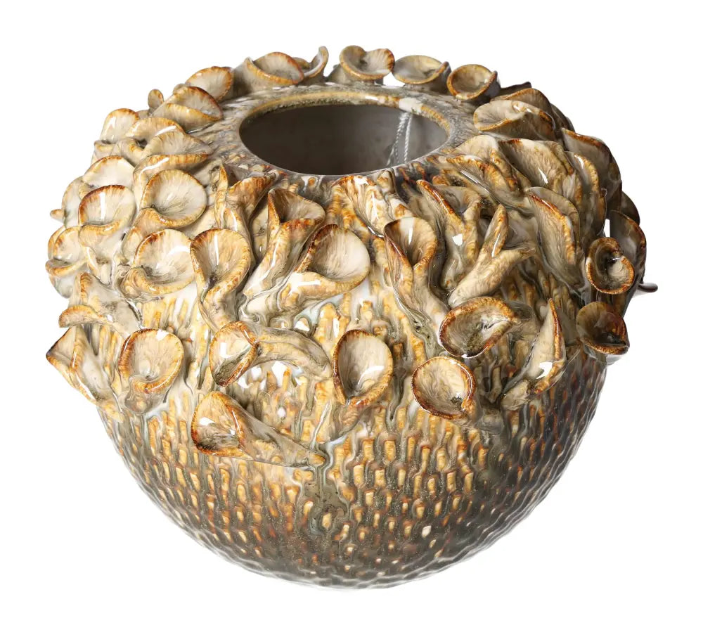 Artistic stoneware vase with intricate sea life design, showcasing detailed craftsmanship in earthy tones.