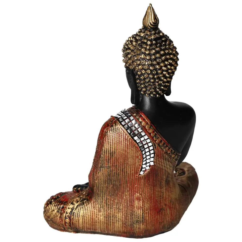 Buddha statue with black and gold finish, crafted from polyresin, showcasing intricate details and luxury design by Sylvia Crystals.
