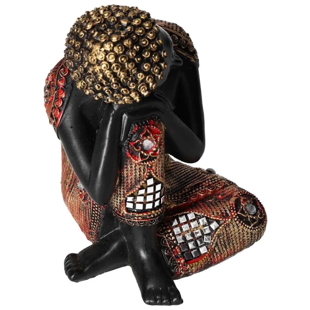 Black and Gold Buddha statue by Sylvia Crystals, featuring intricate craftsmanship and luxurious design elements, promoting conscious living.