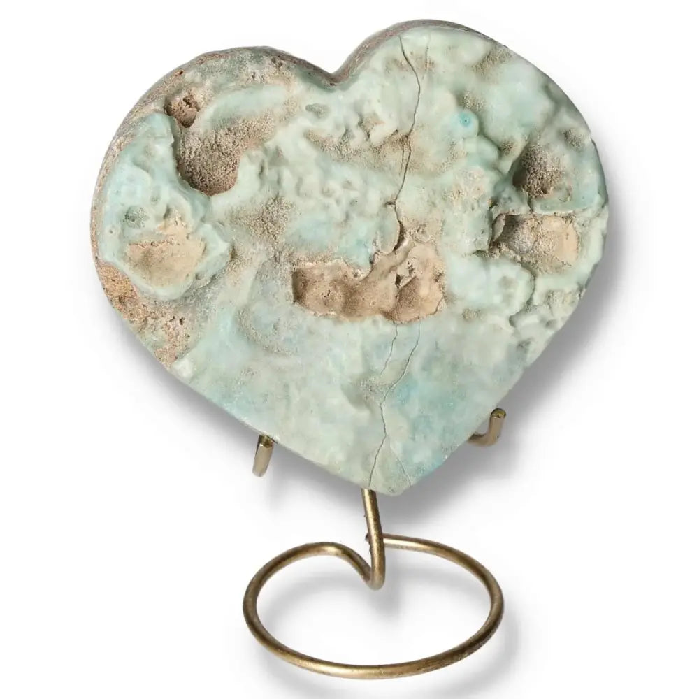 Blue Aragonite Heart crystal on stand, showcasing soothing blue hues, symbolizing emotional balance and clear communication.