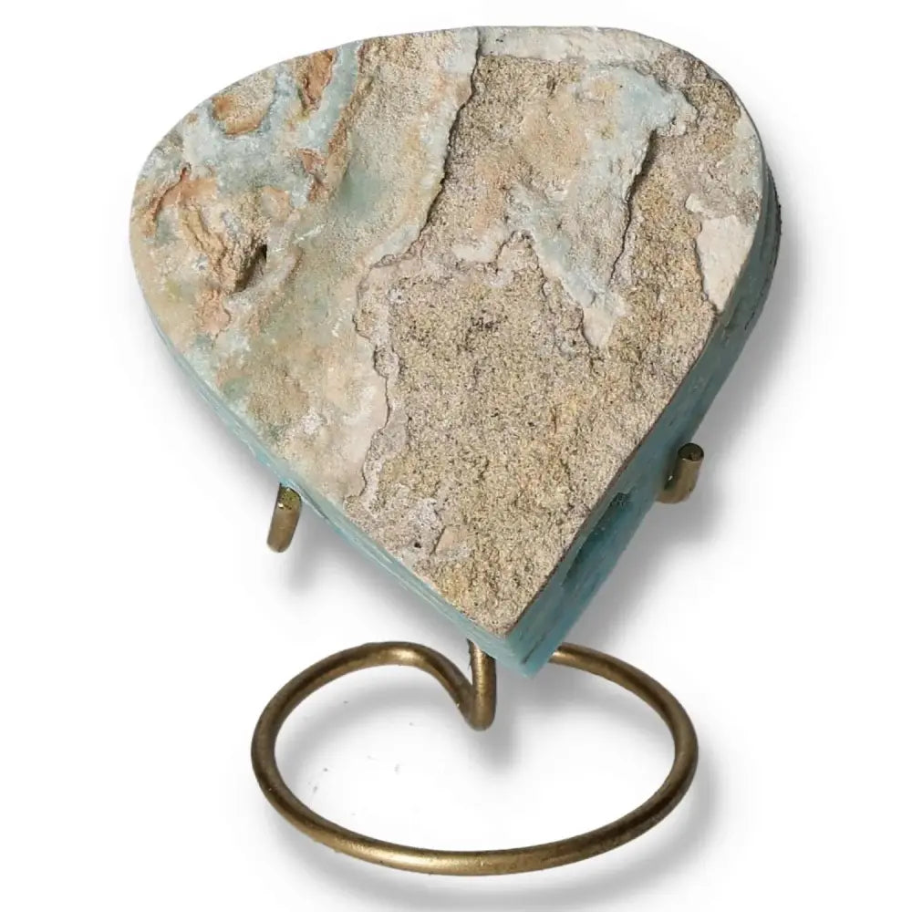 Blue Aragonite Heart crystal stone on a stand showcasing unique natural textures and calming hues.