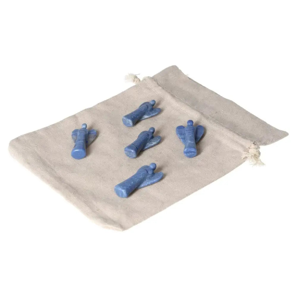 Set of five small blue Aventurine angel crystals on a beige cloth, symbolizing inner peace, intuition, and gentle strength.