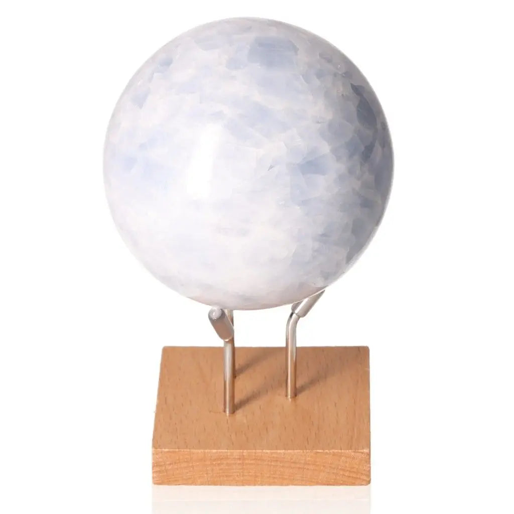 Serene blue calcite sphere on a stand for stress relief, communication enhancement, and emotional balance.