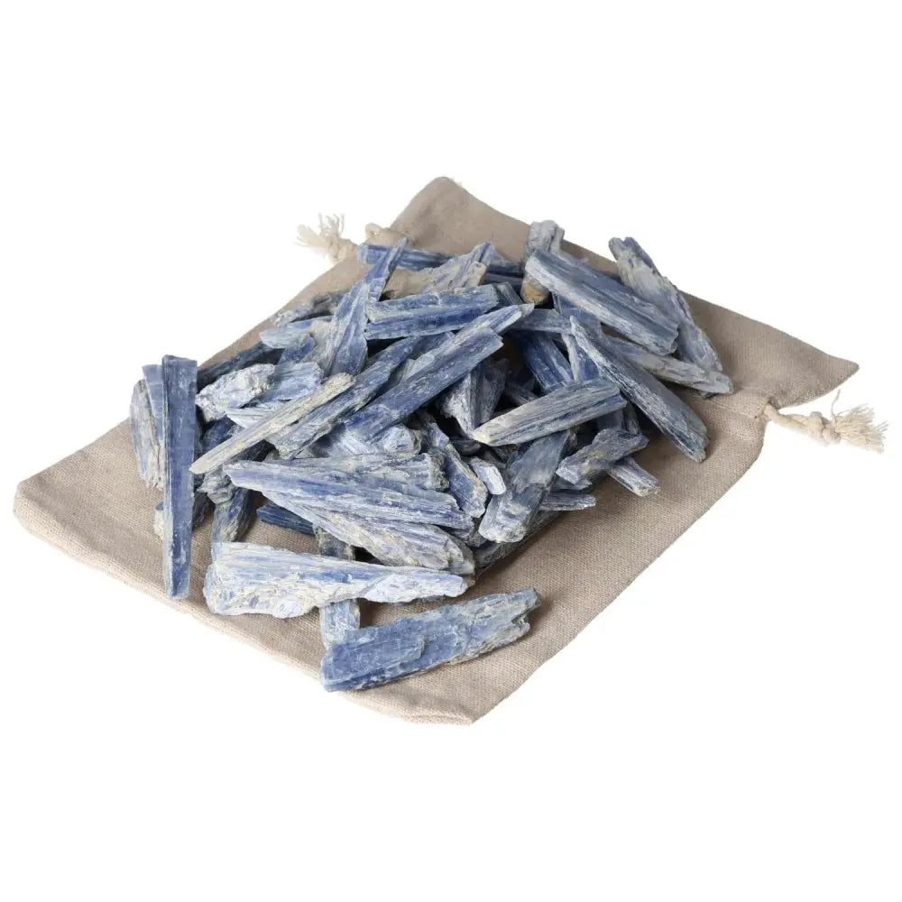Blue Kyanite sticks on a cloth pouch, known for enhancing concentration and aiding in balanced transformation.