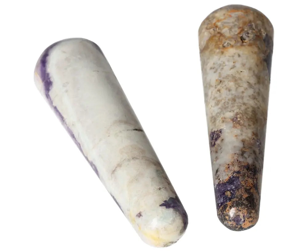 Close-up of two Bolivianite wands, featuring natural purple and beige hues, ideal for crystal healing or decorative purposes.