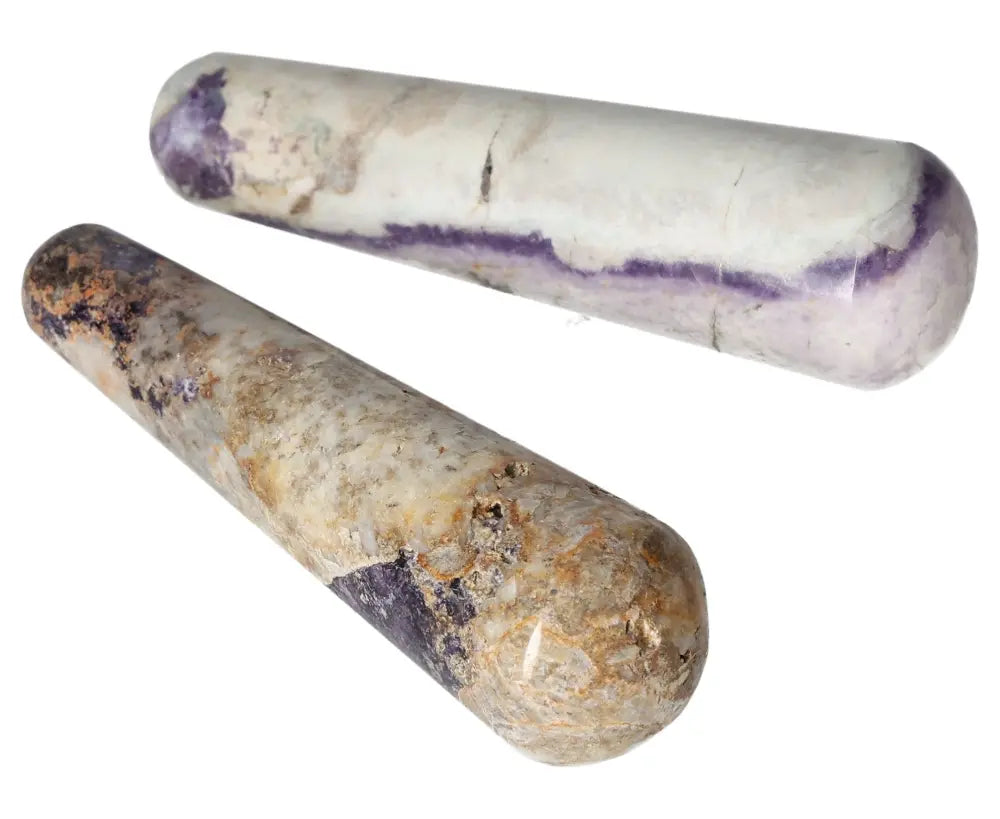 Two Bolivianite wands featuring a polished finish with purple and beige tones, ideal for healing and meditation practices.