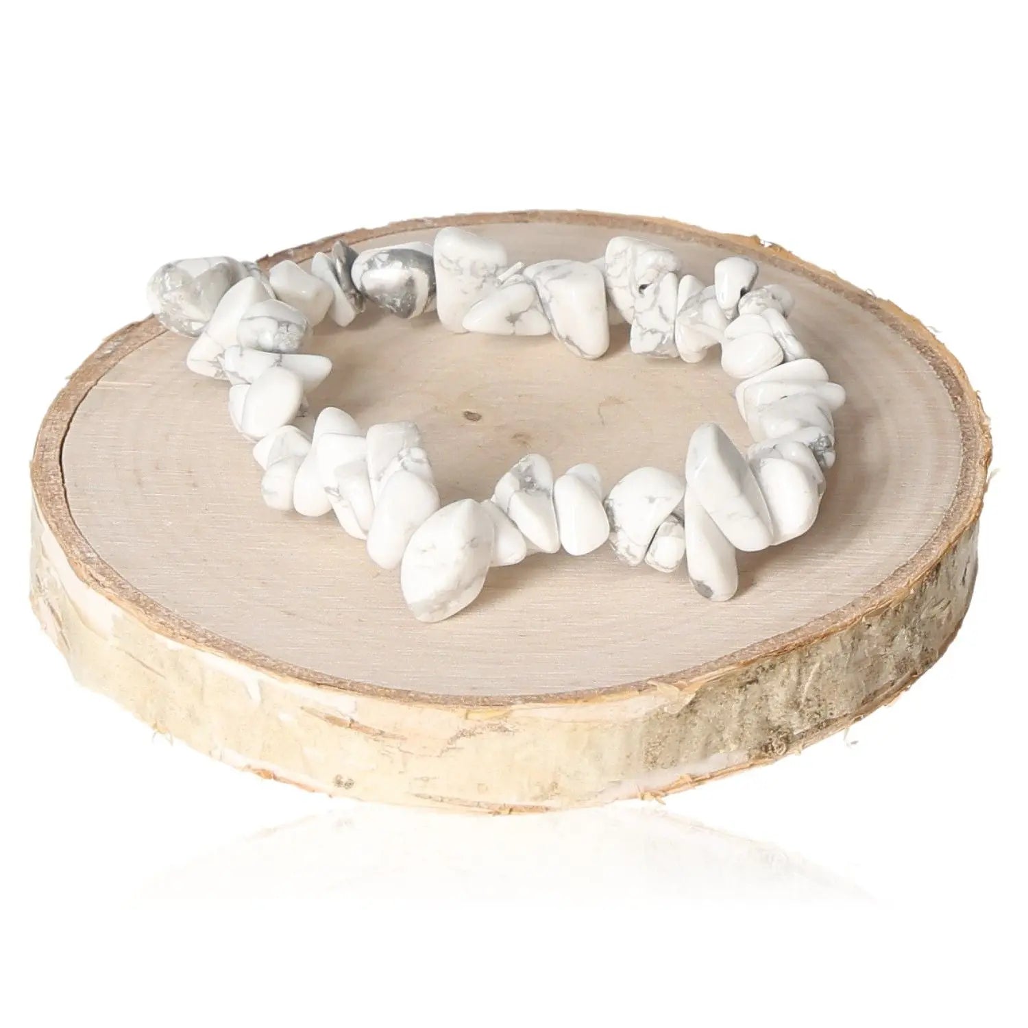 Elegant bracelet crafted with genuine magnesite chips, showcasing natural artistry and earthy elegance on a wooden display.
