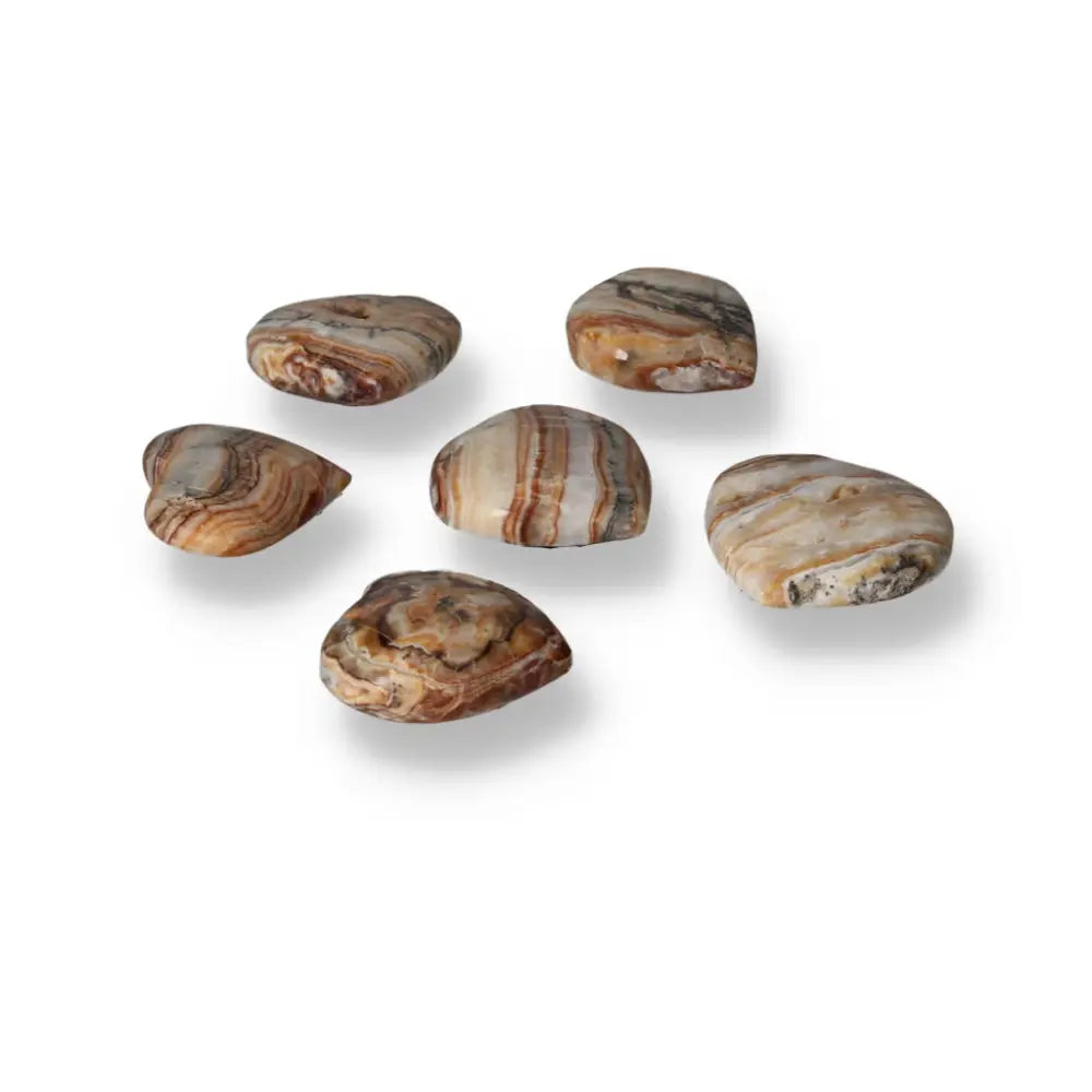 Brown Aragonite Heart gemstones on white background, showcasing unique earthy tones and intricate crystal formations for grounding energy.