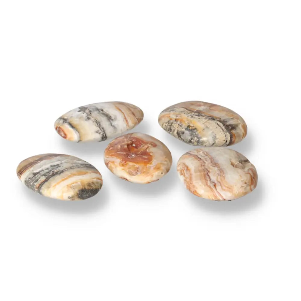 Five polished Brown Aragonite palm stones displaying earthy tones for meditation and stress relief.