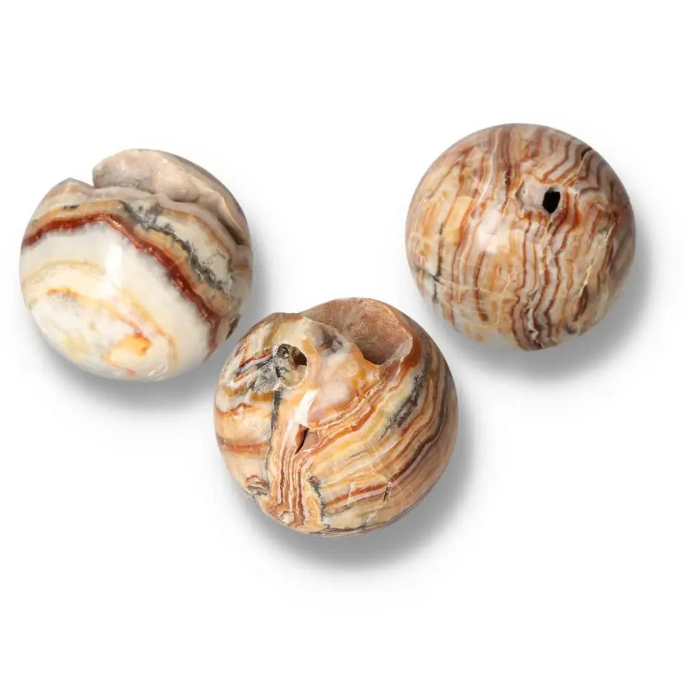 Brown Aragonite spheres showcasing earthy tones and intricate crystal formations for grounding and emotional healing.