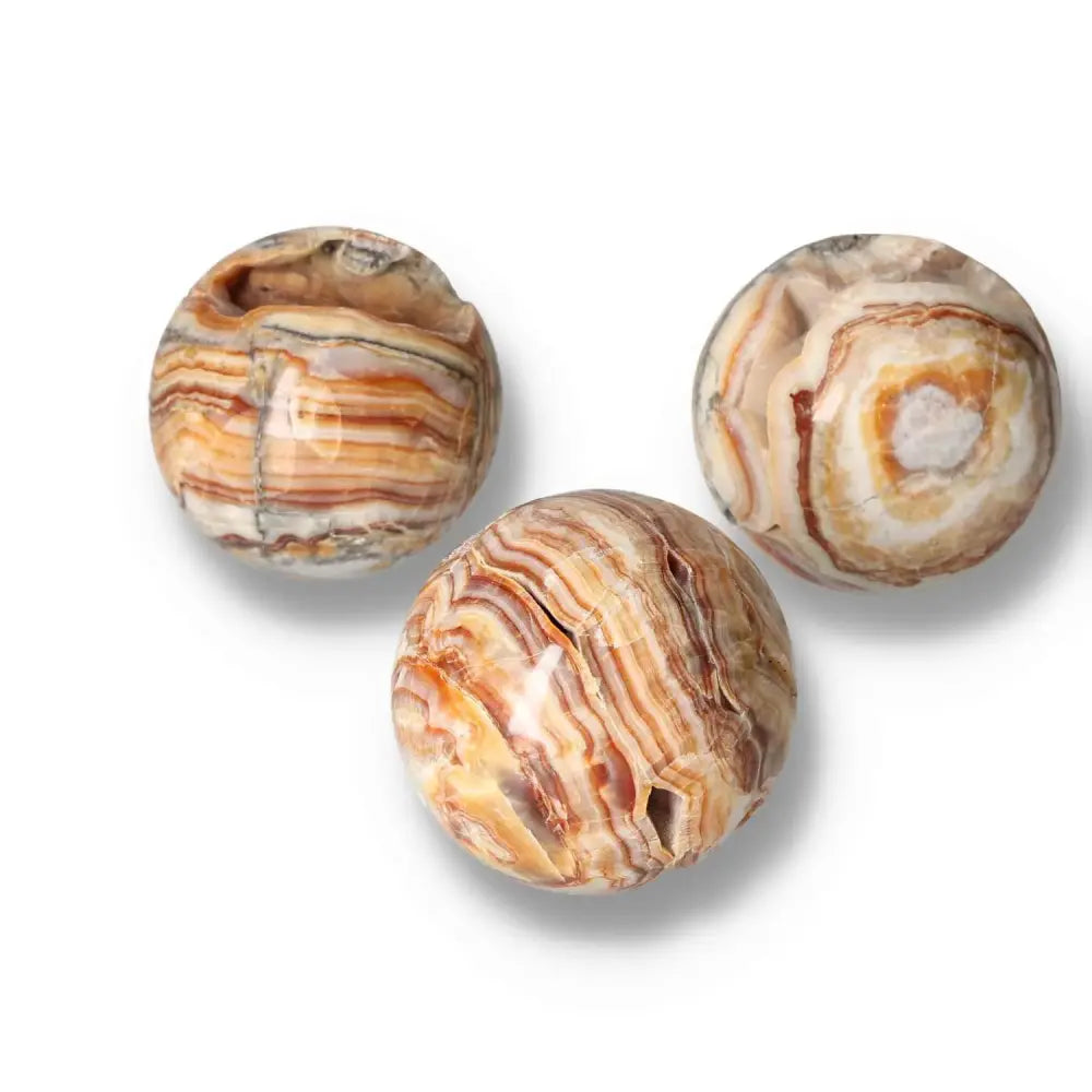 Three Brown Aragonite spheres showcasing intricate patterns and warm earthy tones, perfect for grounding energy and emotional healing.