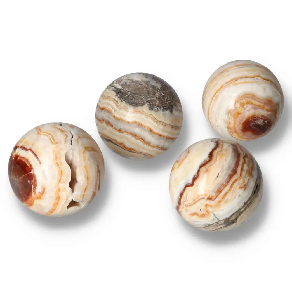 Four Brown Aragonite spheres displaying unique earthy tones and intricate crystal formations, ideal for stability and emotional healing.