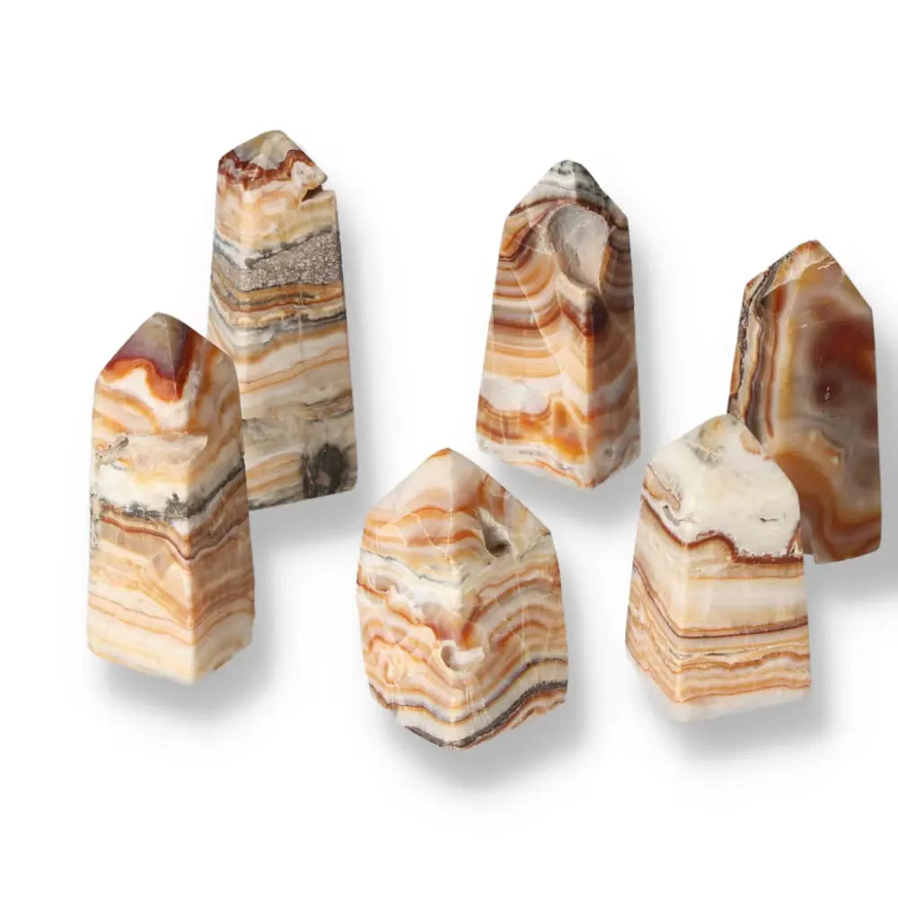 Set of brown aragonite towers with earthy tones, offering grounding energy and enhancing space with natural beauty and metaphysical benefits.