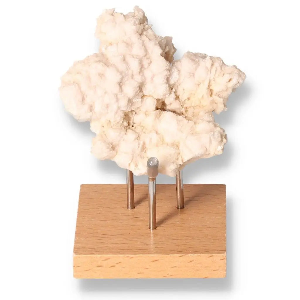 Natural calcite mineral on display stand enhancing motivation, energy, and self-confidence for learning and work environments.