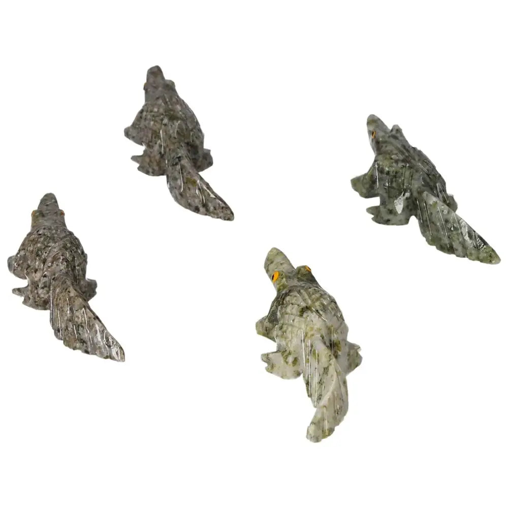 Hand-carved dolomite alligator figurines showcasing detailed craftsmanship and natural stone elegance for luxury decor.