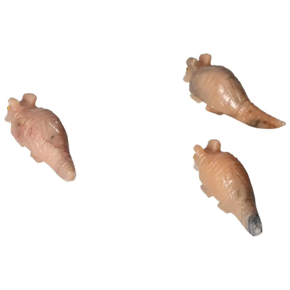 Three carved dolomite armadillos from Sylvia Crystals, known for soothing emotions and spiritual elegance, on a white background.