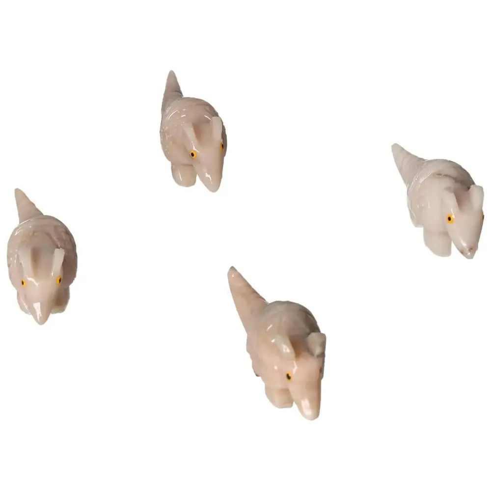Four intricately carved dolomite armadillos, representing tranquility and elegance. Aesthetic and spiritual home decor from Sylvia Crystals.