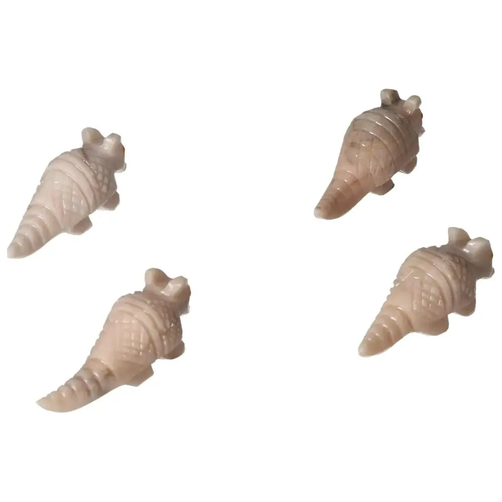 Elegant carved dolomite armadillo figurines by Sylvia Crystals, embodying tranquility and grounding properties for serene spaces.