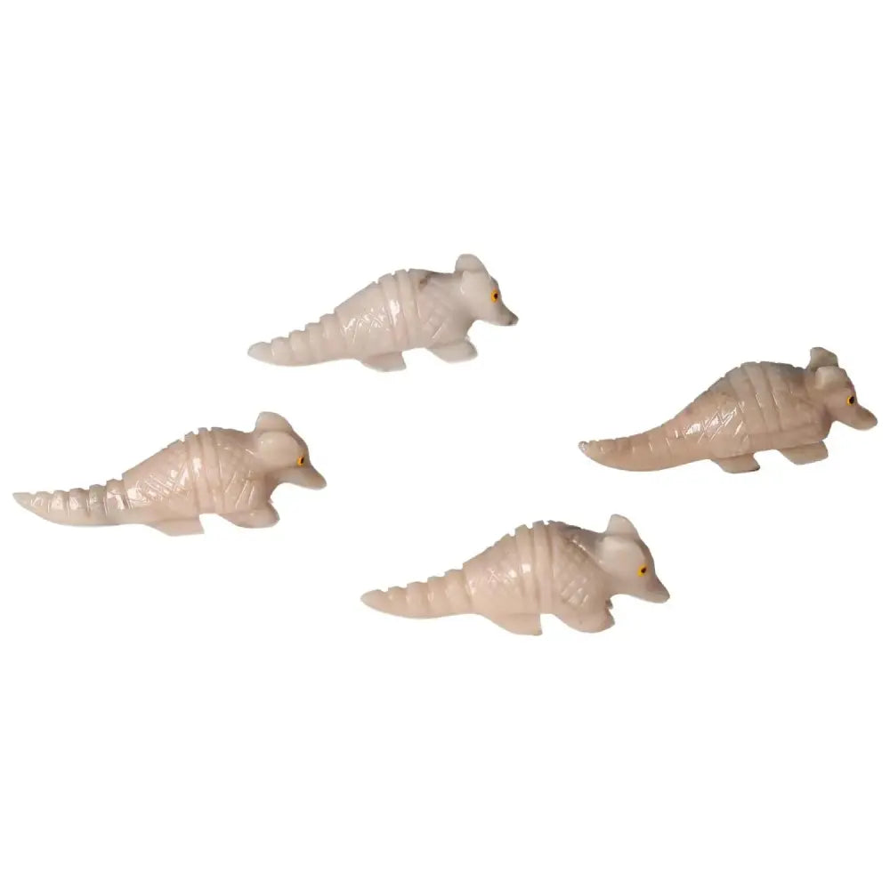 Four carved dolomite armadillo figurines symbolizing tranquility and grounding, crafted for spiritual calm and elegance.