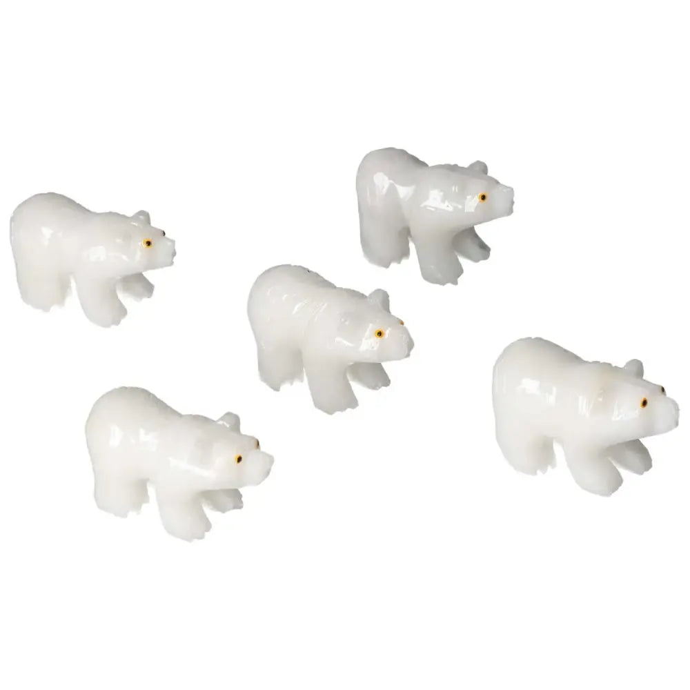 Group of carved dolomite bear figurines from Sylvia Crystals, showcasing luxury and design, perfect for enhancing decor and well-being.