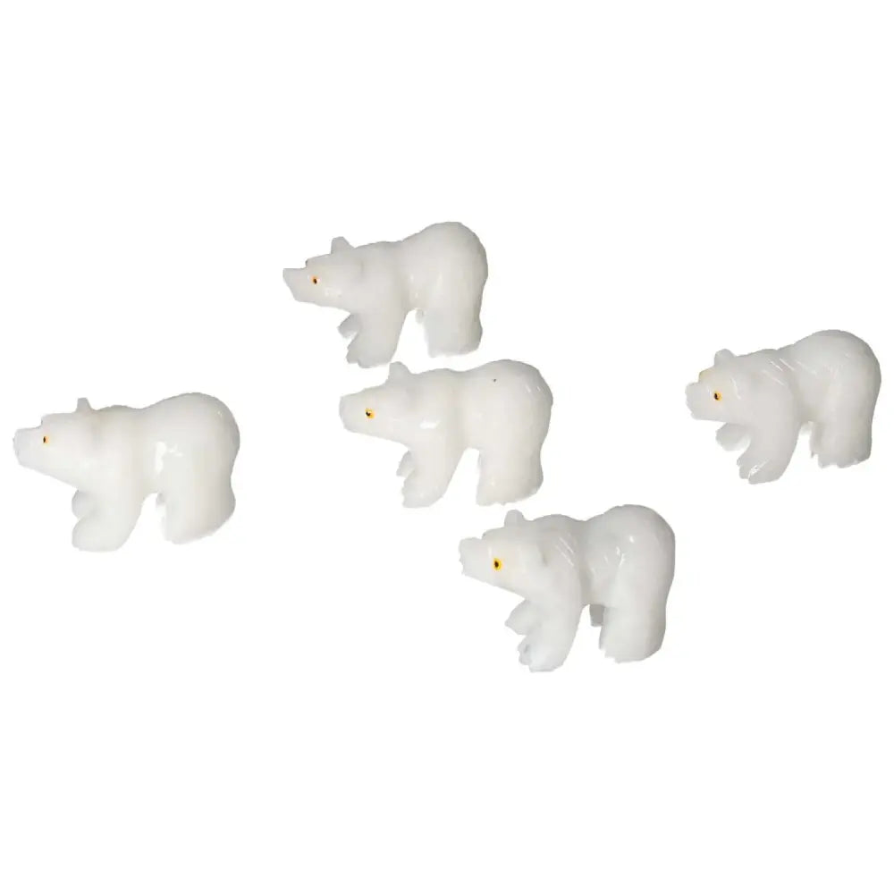 Set of four carved dolomite bear figurines symbolizing luxury and spirituality, perfect for enhancing decor and promoting well-being.